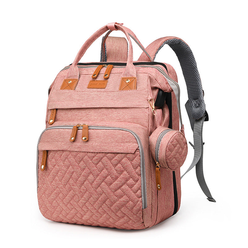 Baby travel backpack with storage and fold-out attachment