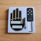 Open package containing an LED hand gesture light and remote control