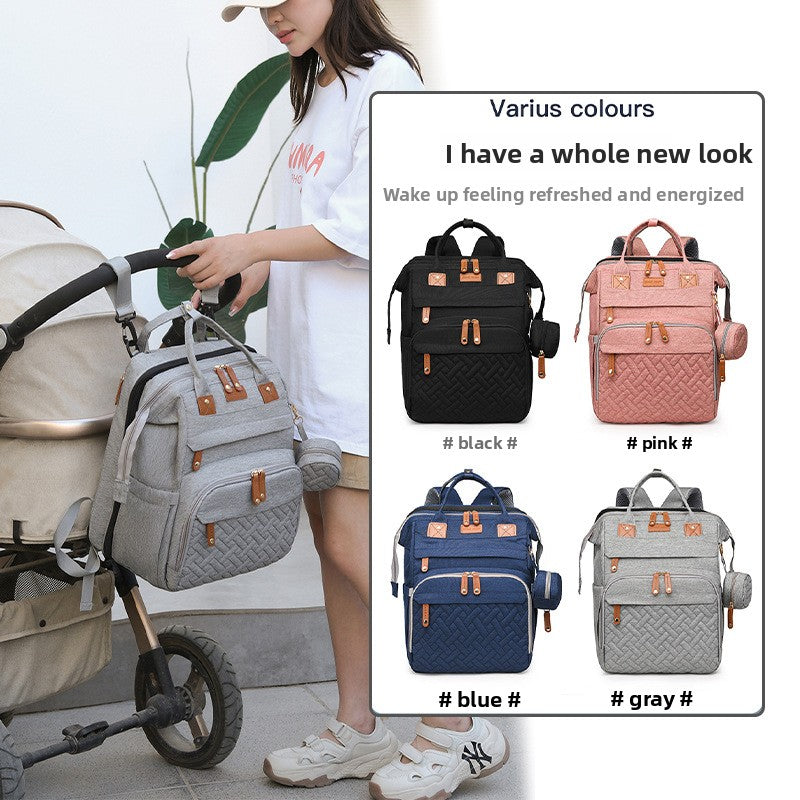 Baby travel backpack with storage and fold-out attachment