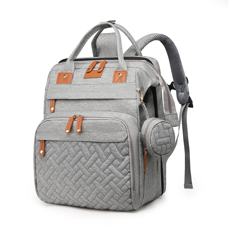 Baby travel backpack with storage and fold-out attachment
