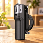 Folded black magnetic selfie stick on a wooden desk