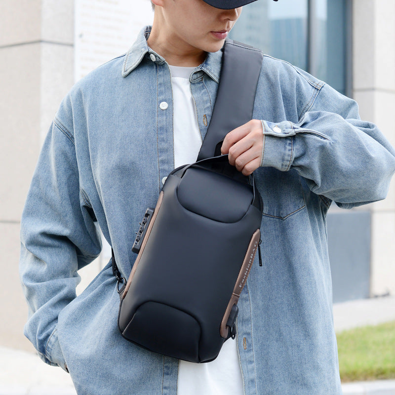 Person wearing a dark sling chest bag across the body