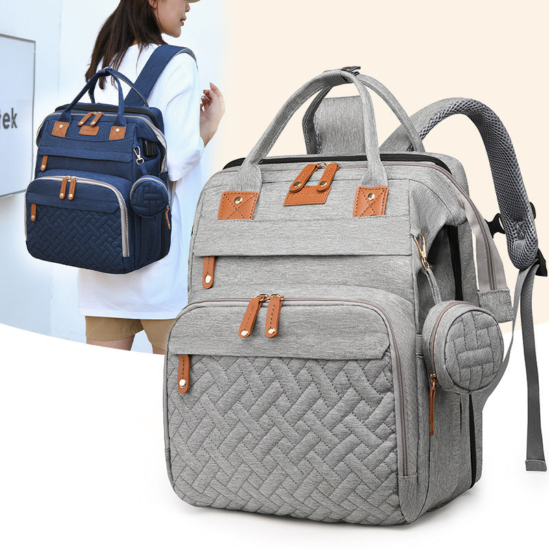 Baby travel backpack with storage and fold-out attachment