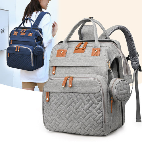 Baby travel backpack with storage and fold-out attachment